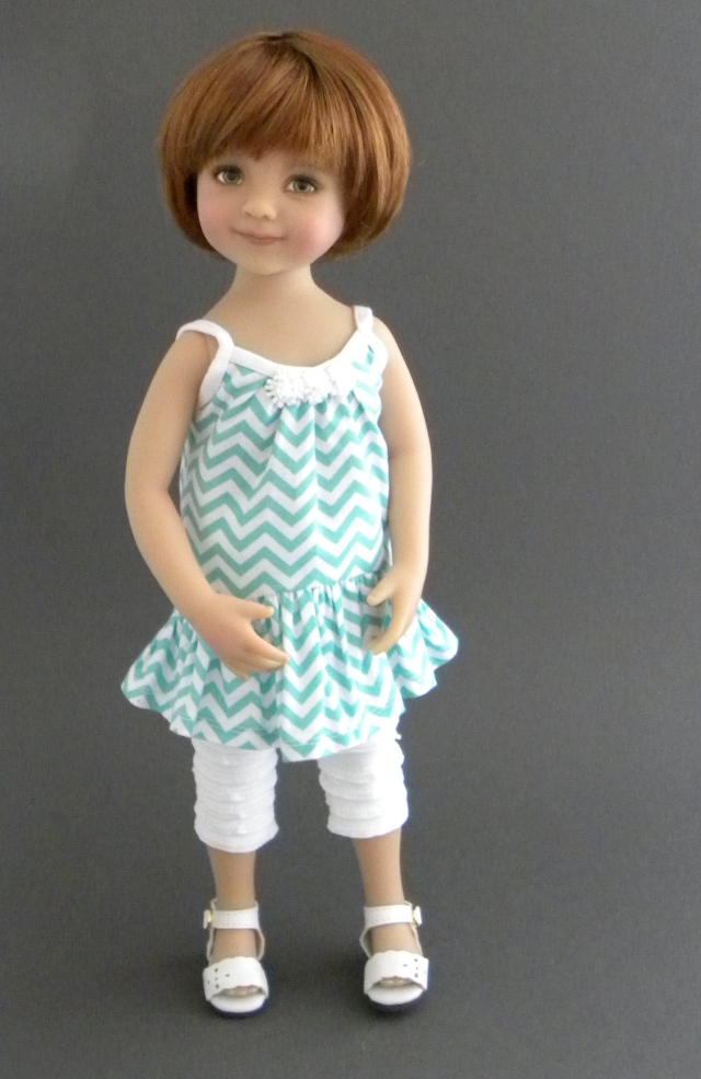 Matilda models the chevron tunic dress with ruffled leggings